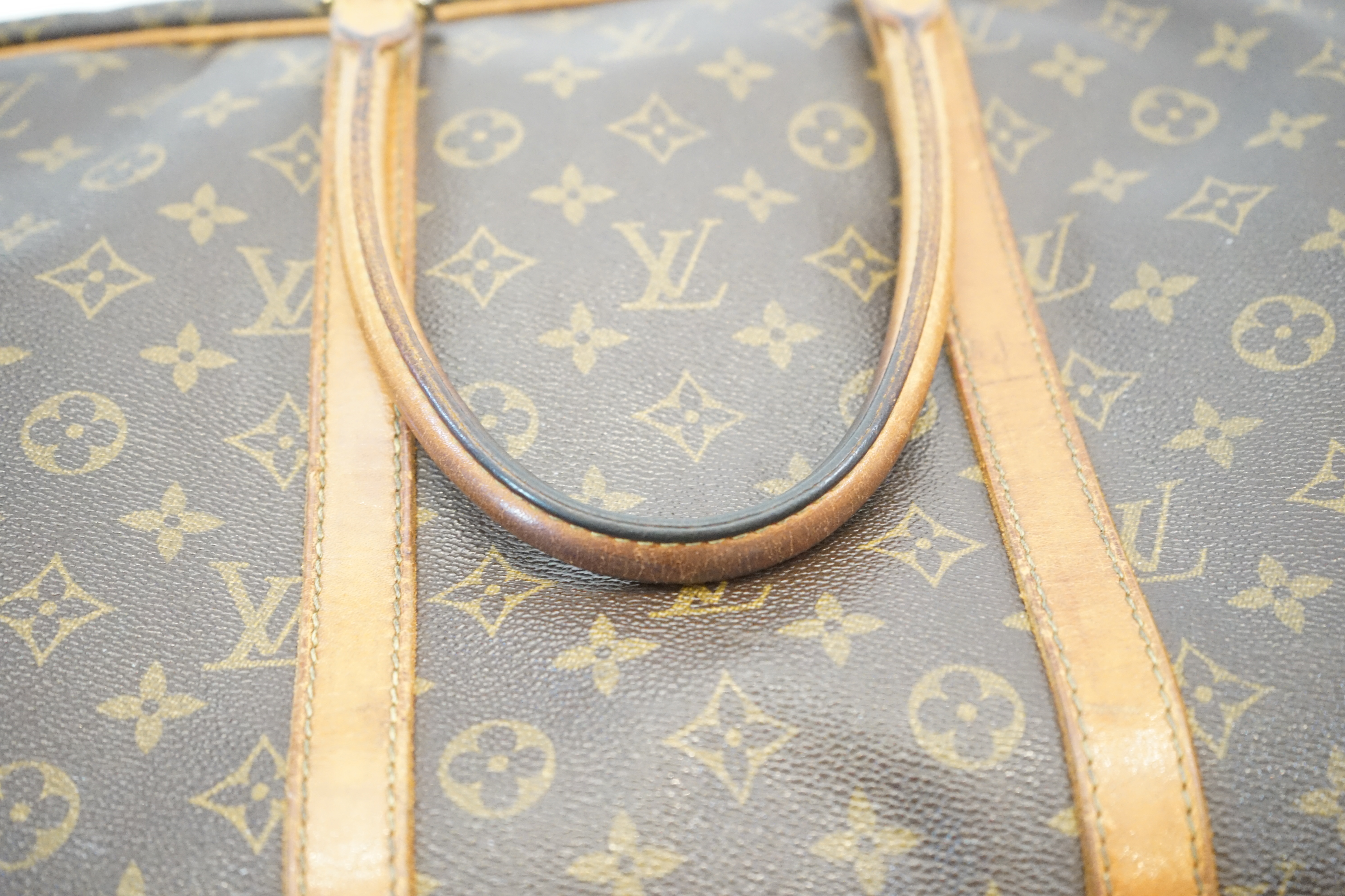 A Louis Vuitton Keepall leather travel bag with luggage tag width 13cm, length 45cm, height 30cm